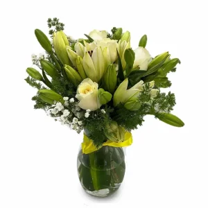 Graceful mixed flowers in a clear glass vase